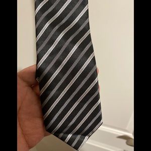 Black grey and white striped tie